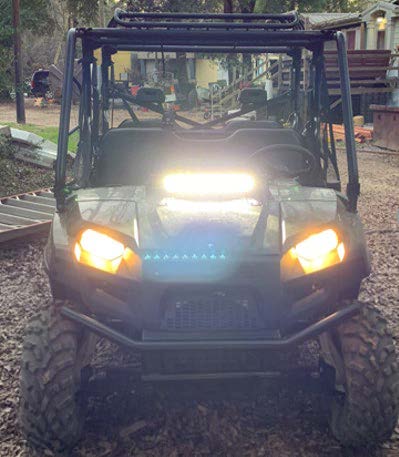 Front view of the stolen 2023 Polaris Ranger with the lights on at the property. 